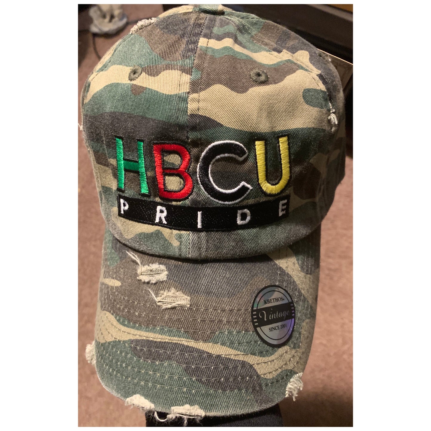 The "Disguise" HBCU Pride Banner Distressed Hat in Camo